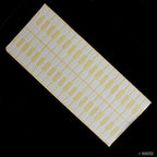 Sheet of white jewellery pricing tag labels with dumbell bag seals
