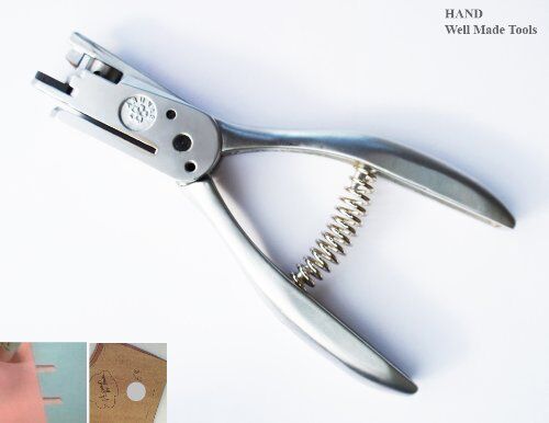 2 IN 1 pattern notcher and hole punch on a work surface