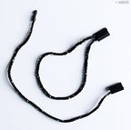 Close-up of black and silver round snap locks for crafting.