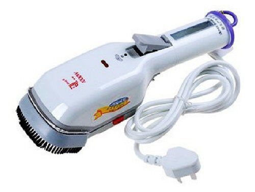 Held garment steamer displayed on a table