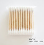 Three packs of double end wooden grip cotton swab buds in white.