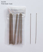 Close-up of a single No.50 embroidery needle showing its sharp pointed end.