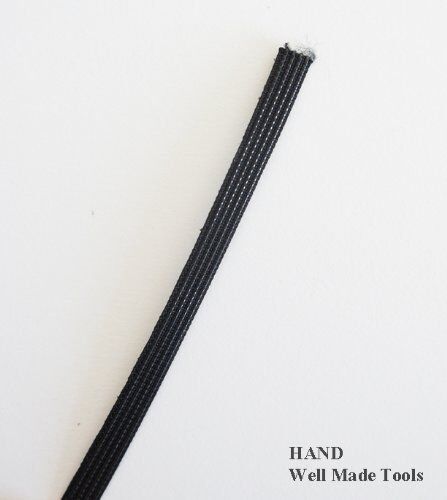 Cut piece of black boning used in garment construction