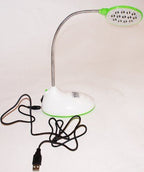 Desktop lamp in use on a crafting table