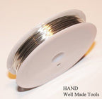 Fine silver wire displayed with beads for jewellery making.