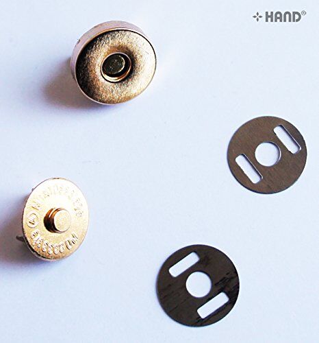 Close-up of a 14mm gold magnetic button for bag clasps.