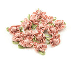 Pastel pink ribbon bow sew on trim with fabric flower detail.