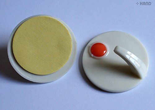 Self adhesive hooks in use, holding items in a bathroom setting.