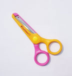 Scissors displayed on a craft table with materials