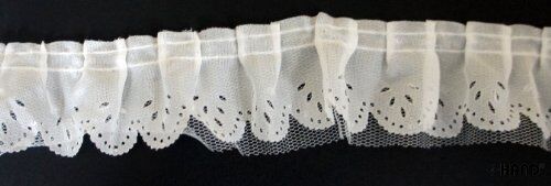 Close-up of white two layers nylon ruffle trim