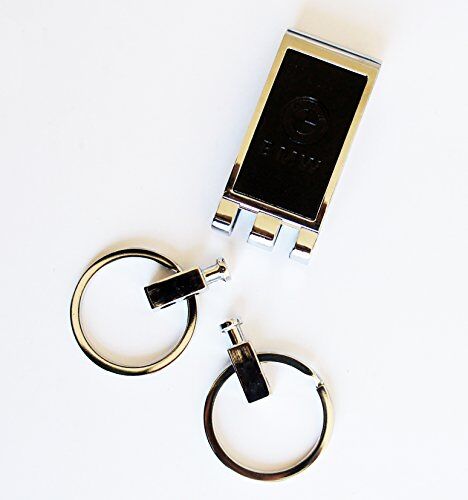 Keyring displayed on a wooden surface with tools