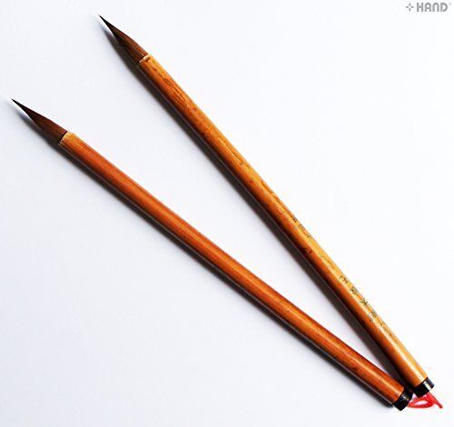 Two bamboo large strokes sumi brushes set on a white background.
