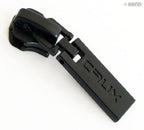 Close-up of a navy blue 'Crux' zip pull showing the head slider