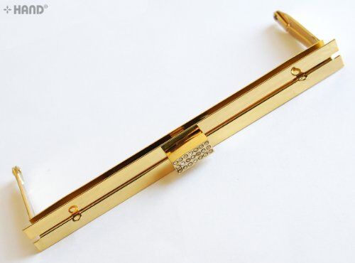 Large long polished purse frame in gold with diamante gems