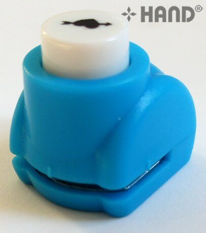 User demonstrating the craft paper punch in action.