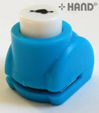 User demonstrating the craft paper punch in action.