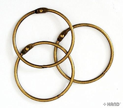 Three vintage gold binding rings on a white background