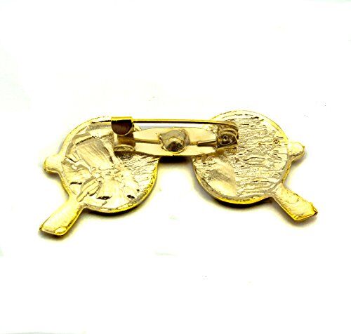 Close-up of a John Lennon dark sunglasses design brooch showing black enamel detail.