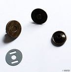 Packaging of 10 sets of vintage gold magnetic press studs.