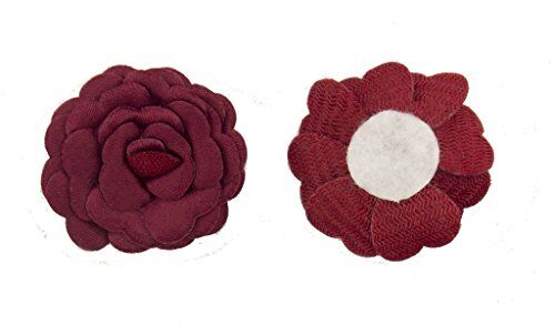 Seven deep blue flower trims arranged together for embellishment.