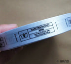 Two rolls of wash care labels ready for use in sewing projects.