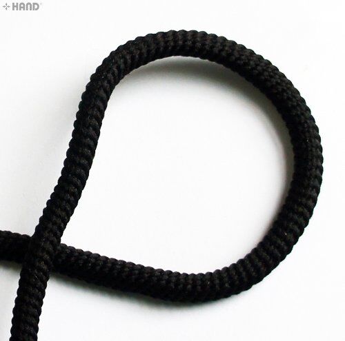 Close-up of 6mm black cord trimming showing texture.
