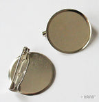 Pack of 50 name badge pins displayed on a table