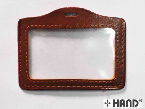 Five fake leather luggage badges in various colours.