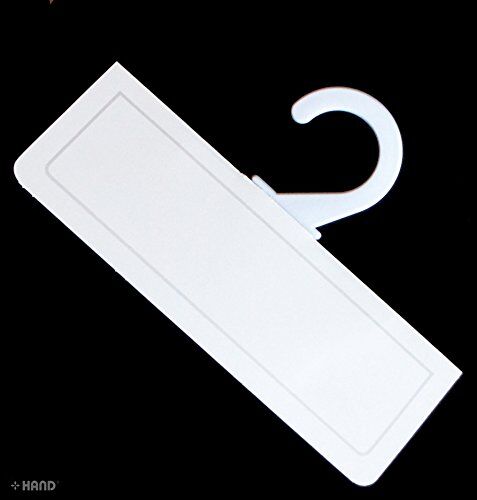 White plastic hangers hanging fabric samples neatly.
