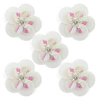 Large white round sequin and diamante flower trim on fabric.