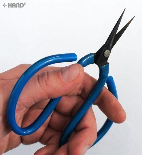 Close-up of the blade of the blue heavy duty scissors