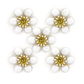 Five white blossom enamel and brass flower trims arranged neatly.