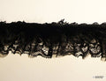 Close-up of decorative black rabbit fur lace trim
