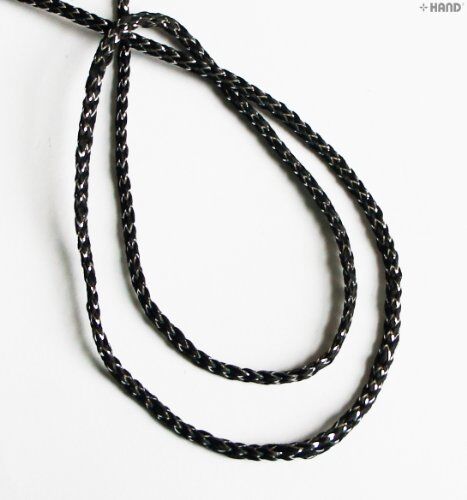 Black and silver string trim with measuring tape for size reference
