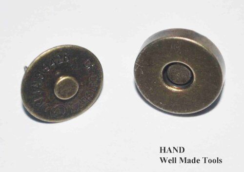Close-up of an antique gold magnetic button, ideal for bags.