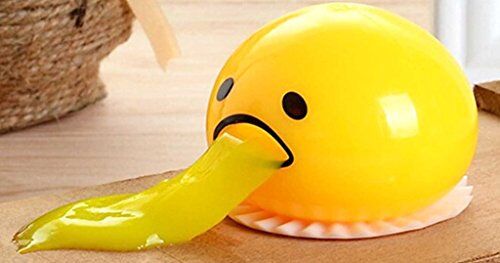 Gudetama stress relief toy held in a child's hand