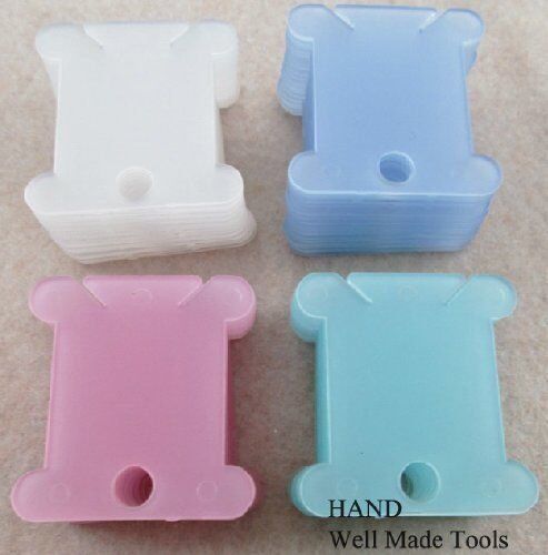 Cross stitching thread winders showing size comparison