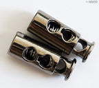 Two-hole design of the dark copper tone cord locks for easy use.