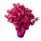 Display of bright pink hang tags with nylon string attached.