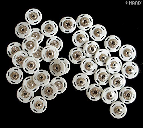 Display of metal and plastic components of the snap fasteners.