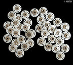Display of metal and plastic components of the snap fasteners.