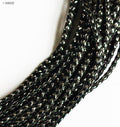 Black and silver string trim on a spool