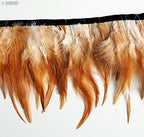 Close-up of the rooster feather fringe showing the stitching detail.