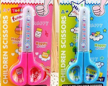 Scissors displayed with the cover on, highlighting the safety feature.