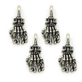 Four silver metal skeleton hand pendants displayed together.
