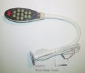 Gooseneck lamp with 12 LED lights positioned over a sewing project
