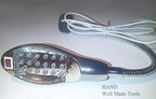 Gooseneck lamp positioned over a sewing project