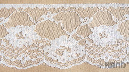 White NO.910 lace border trim displayed on a flat surface