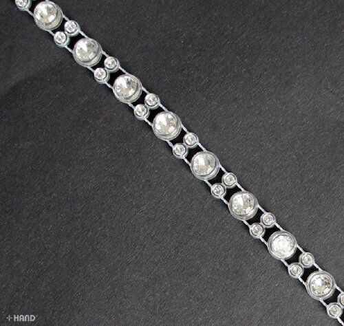 Close-up of crystal clear rhinestones trim on a roll