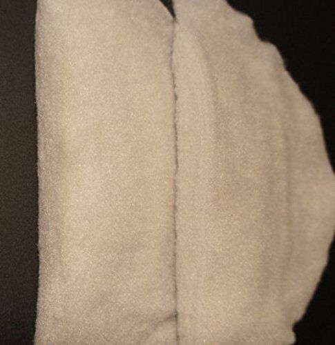 Two pairs of white shoulder pads displayed on a flat surface.